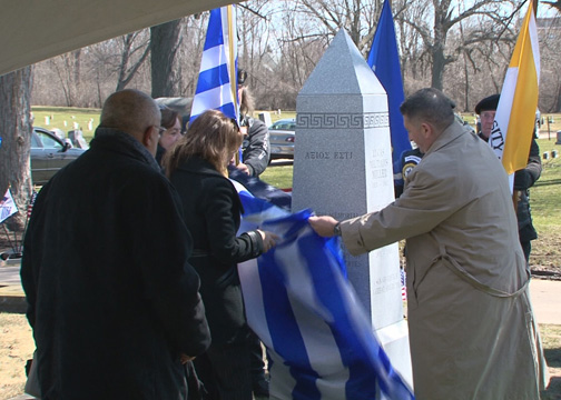 Ioanna Efthymiadou, Consul General of Greece, and John Scocos, unveiling the memorial obelisk.